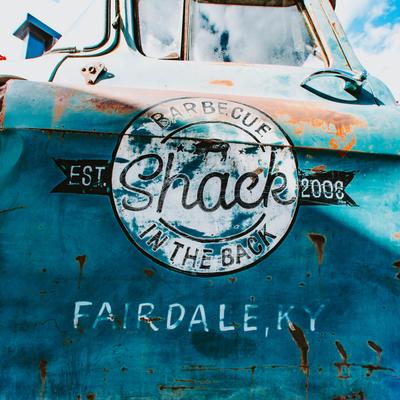 A rustic truck outside.