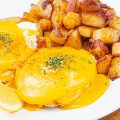 Eggs Benedict with home fries.