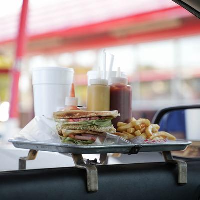 tray of food hanging on car window.