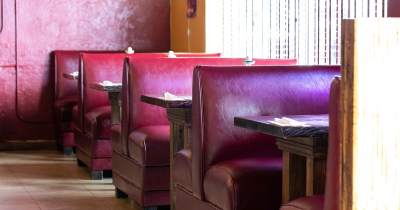 Inside, red booth seating area, closeup