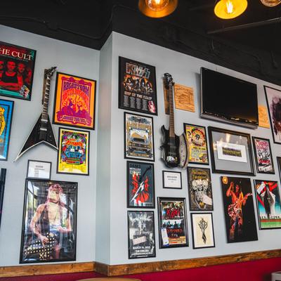 Interior, a wall decorated with  rock and roll memorabilia.