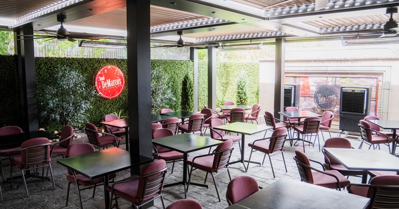 Exterior, covered patio with chairs and tables
