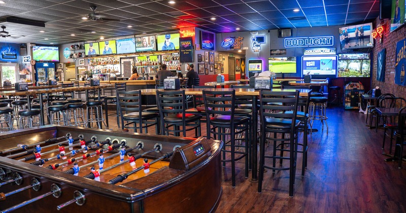 Interior, seating area with high tables and chairs