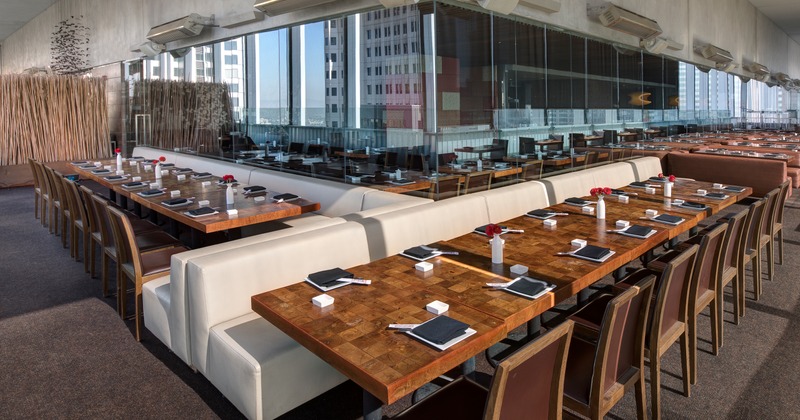 Interior, spacious dining area, fully set tables