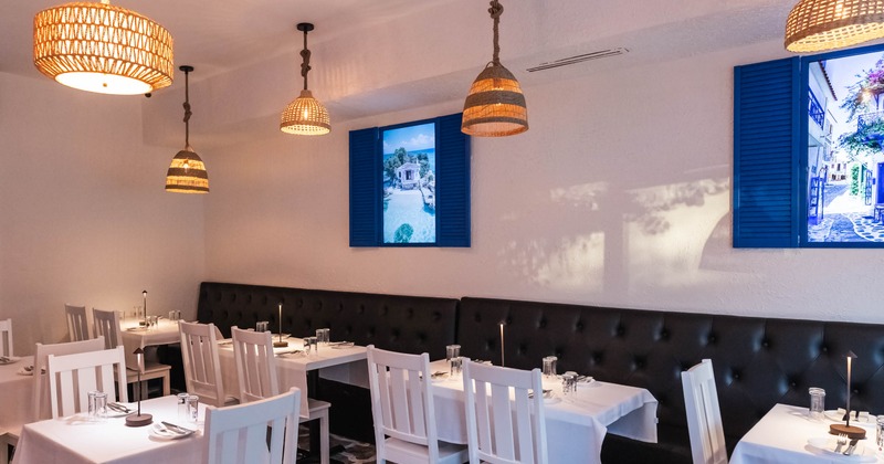 Interior, dining area, banquette benches with wooden tables and chairs, tables for two