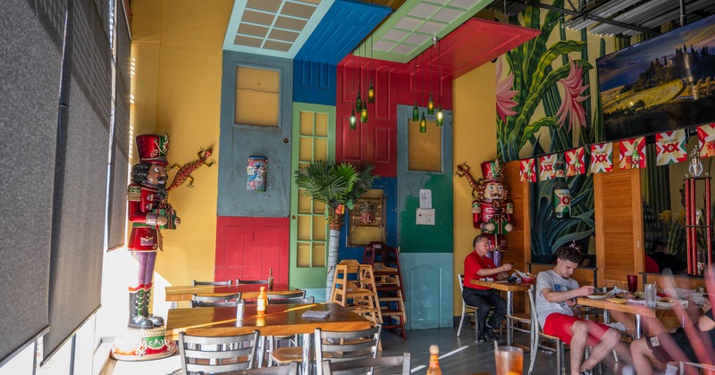 Eclectic restaurant interior with colorful doors