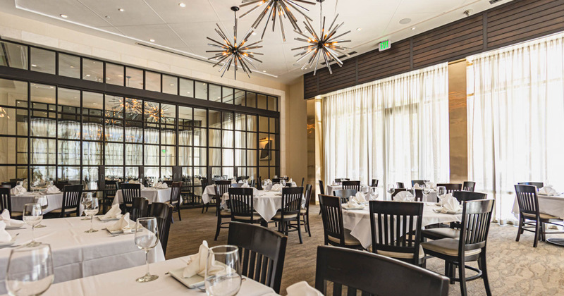 Dining tables set with tableware and tablecloth