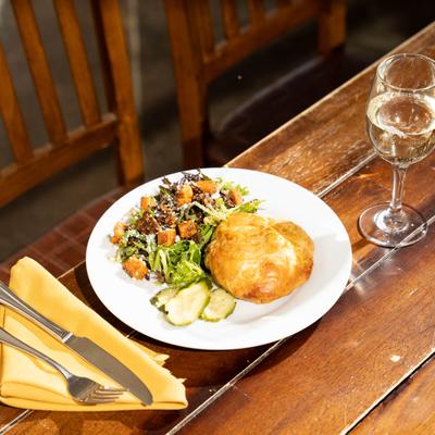 Caesar salad and a small loaf of bread.