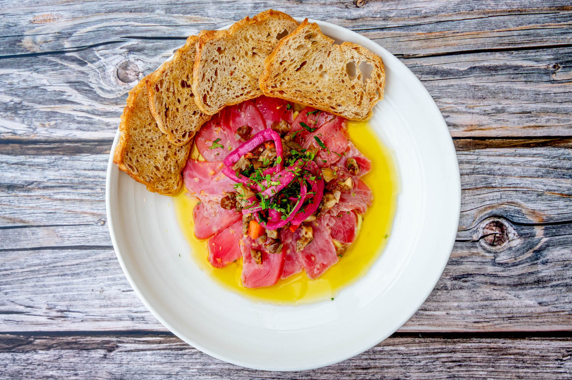 Tuna Crudo served with crostini