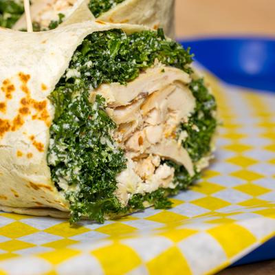 Chicken wrap with kale and cheese.