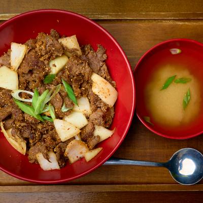 Bulgogi beef served with a bowl of miso soup.