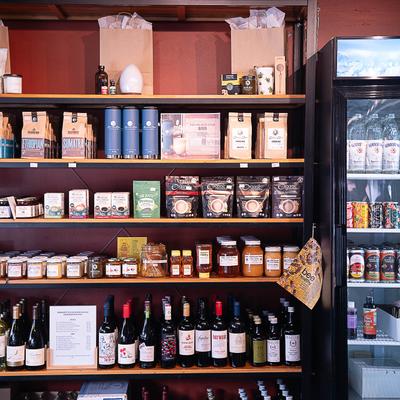 Herb shop interior, shelves filled with assorted goods.