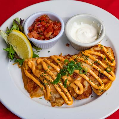 Lobster Quesadilla served with pico and sour cream.