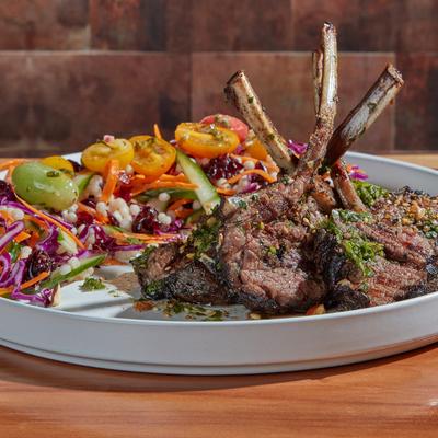 Lamb Chops, with chimichurri sauce, and salad.