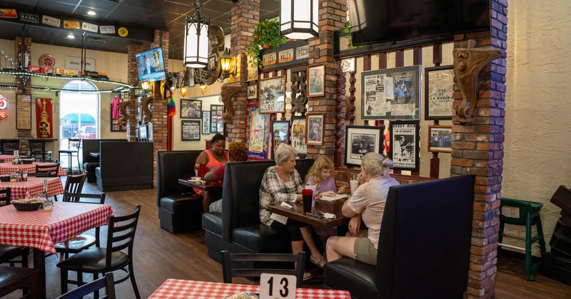 Dining area, tables on the left, and booths on the right