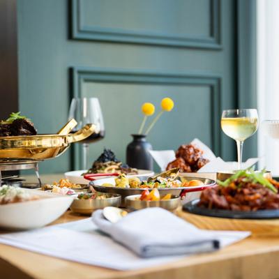 A table full of food and drinks.
