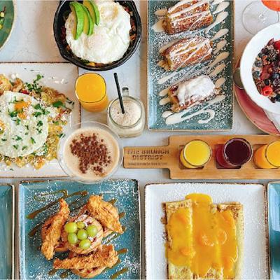 Assortment of dishes and cocktails, overhead view.