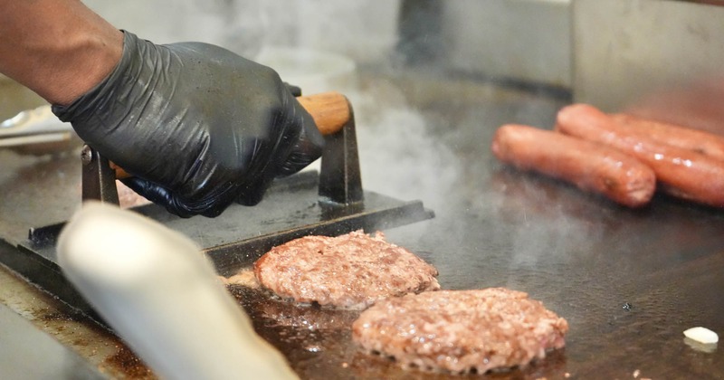 Chef grilling burgers