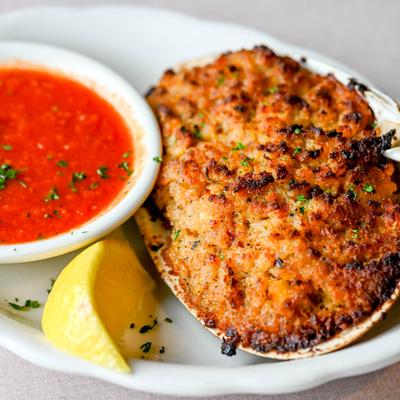 Stuffed quahog clam, with sauce.