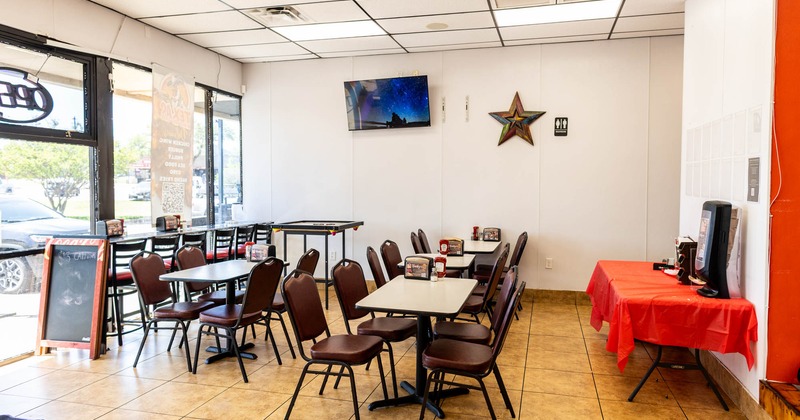 Interior, tables and seats, TV on the wall