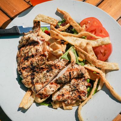 Southwest Chicken Salad featuring fresh vegetables and crispy tortilla strips.
