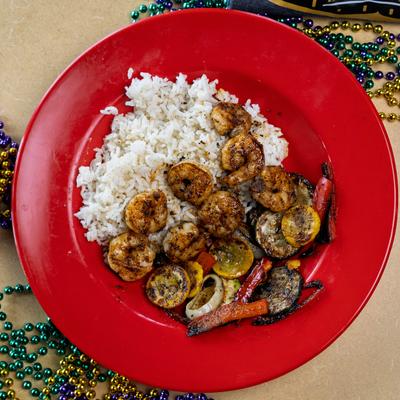 Grilled Shrimp served with rice and vegetables.