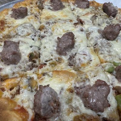 Sausage pizza with melted cheese.