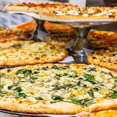 Different kinds of pizza, full table.