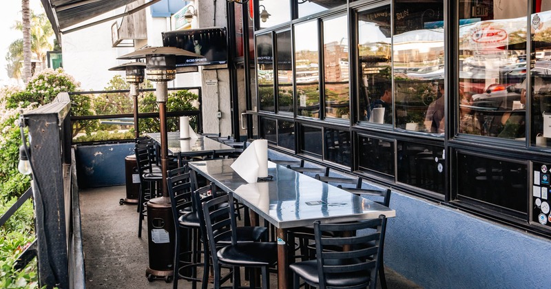 Exterior, long tall table and bar stools