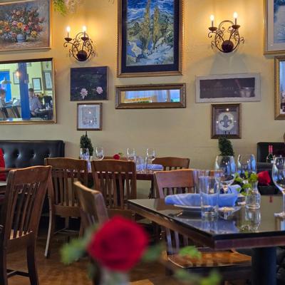 Restaurant interior, tables set for dining, decor.