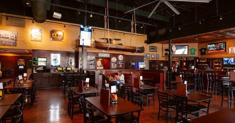 Spacious sports bar with a warm and rustic interior dining area