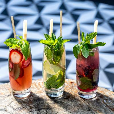 Strawberry, original,  and blueberry mojito cocktail.