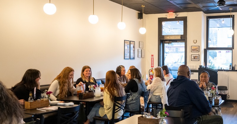 Part of diner room, people, dining