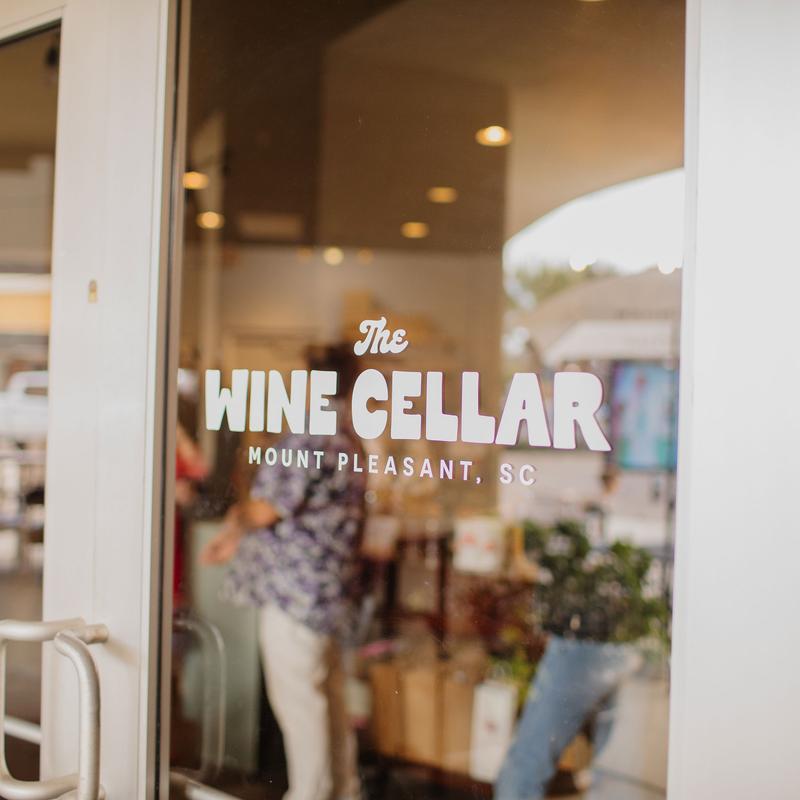 Wine shop storefront window sign.