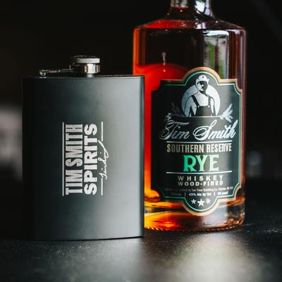 A bottle and a flask of Tim Smith Rye whiskey.