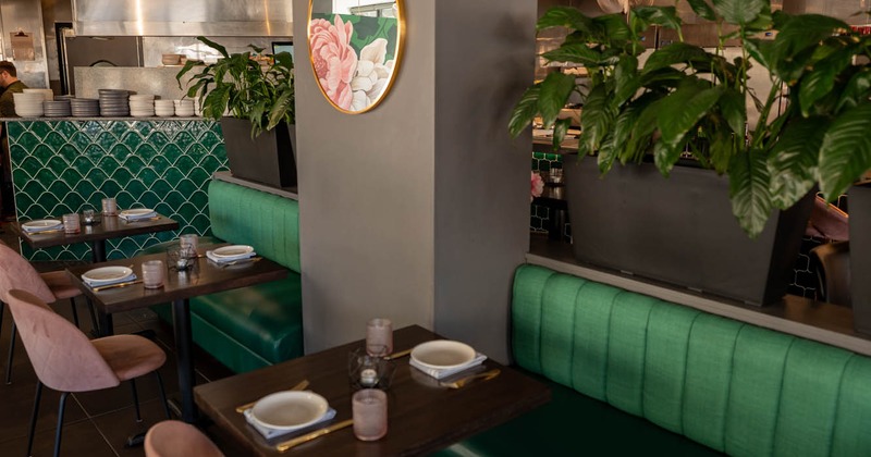 Interior, tables, chairs and green high back chairs