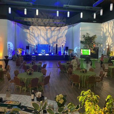 Event room, tables and seats with a stage.