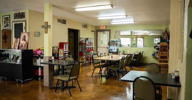 Interior, dining area, tables and chairs, ready for guests, various gumball machines