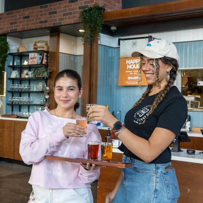 Employees toasting with beers.