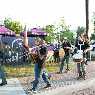 Brass band plays music in the patio.
