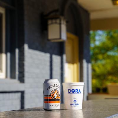 A can of beer and a cup.