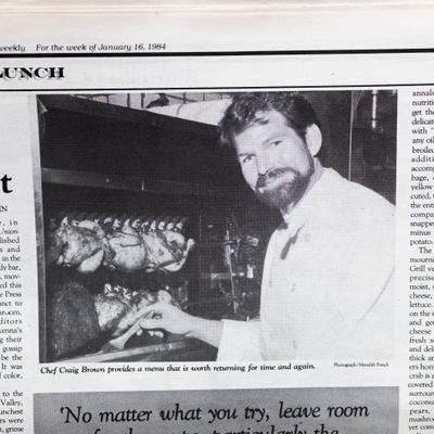 An old newspaper clipping featuring a chef basting rotisserie chicken
