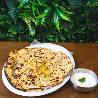 Indian whole-wheat flatbread with raita.