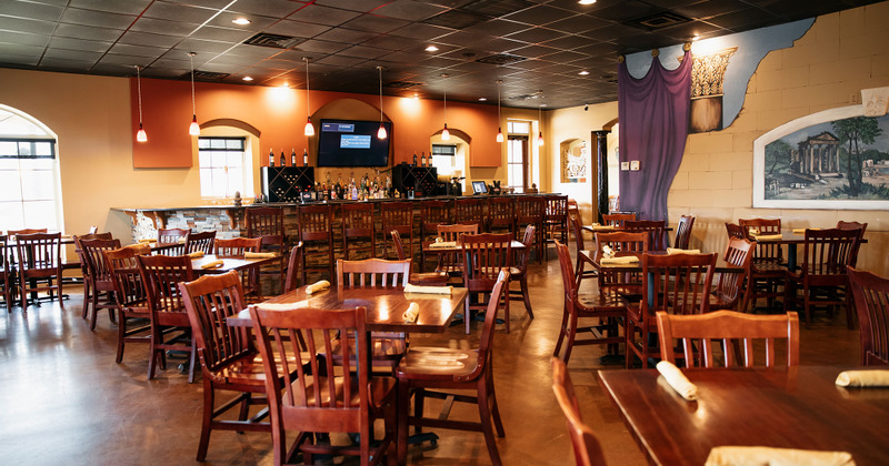 Interior, seating area with the bar in the back