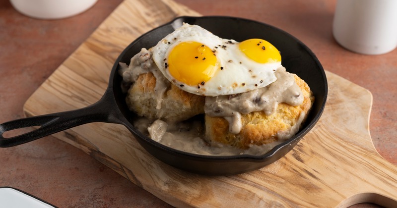 Biscuits, gravy, and sunny side up eggs