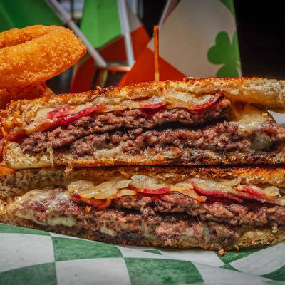 Rustic Reuben Sandwich, with pulled corned beef, Swiss, sauerkraut, and 1000 Island dressing.