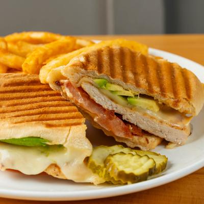 Roasted chicken sandwich, with bacon, tomato, avocado, provolone, and fries.