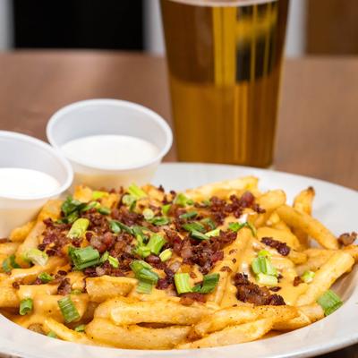 Loaded Fries, with bacon, gouda, cheddar, and scallions.