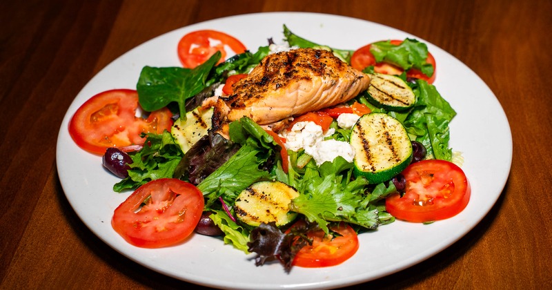 Giovanna salad topped with grilled salmon