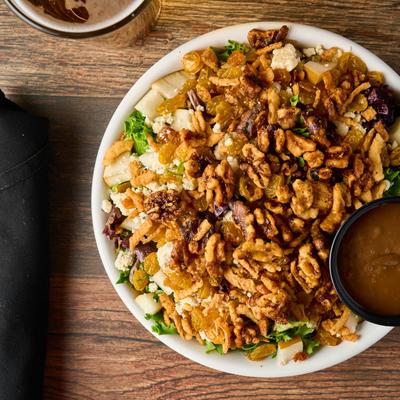 Pear and walnut salad with dressing on the side.